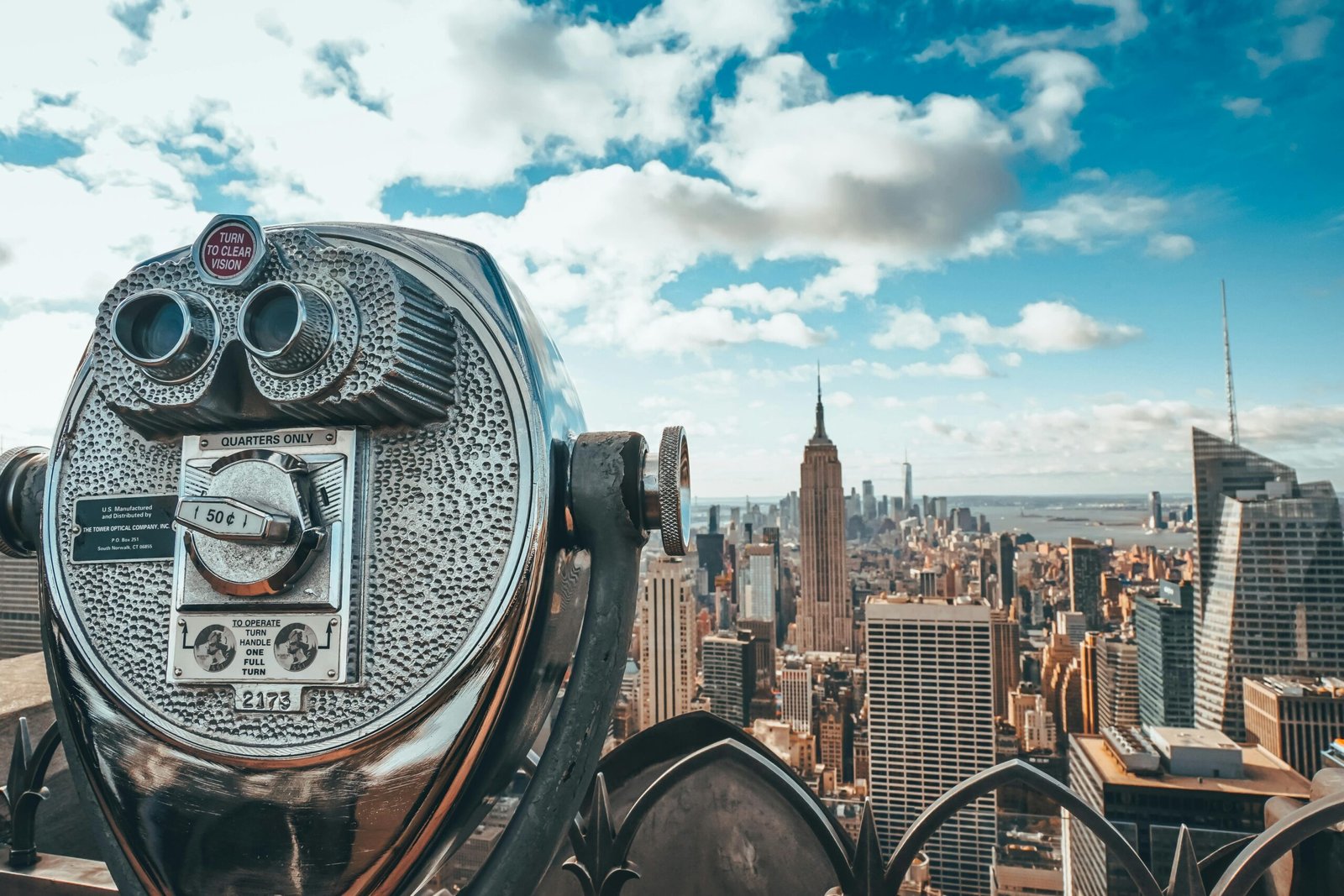 Panoramic view of Manhattan’s skyline from Brooklyn Bridge, emphasizing New York City as a world-class corporate and cultural destination.